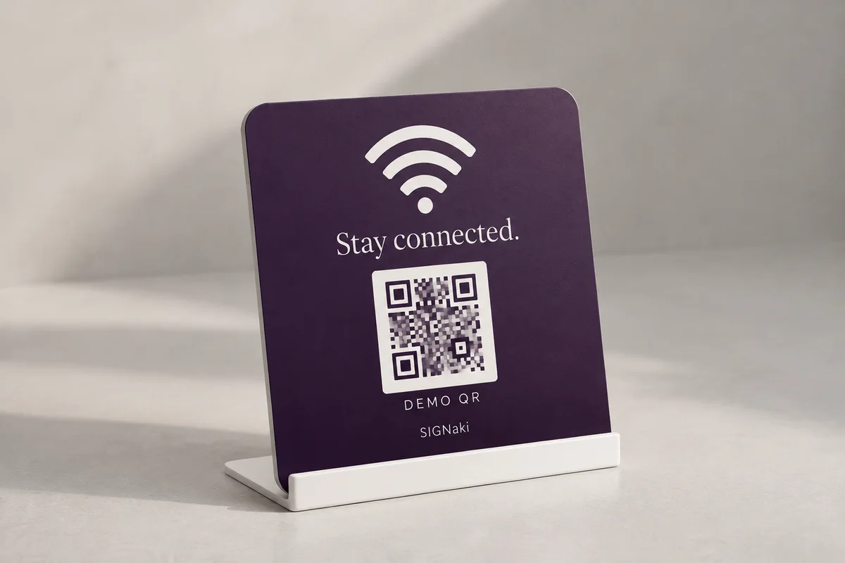 Illustrative design concept of a purple Wi-Fi sign on a white stand, with a Wi-Fi symbol and a demo QR pattern